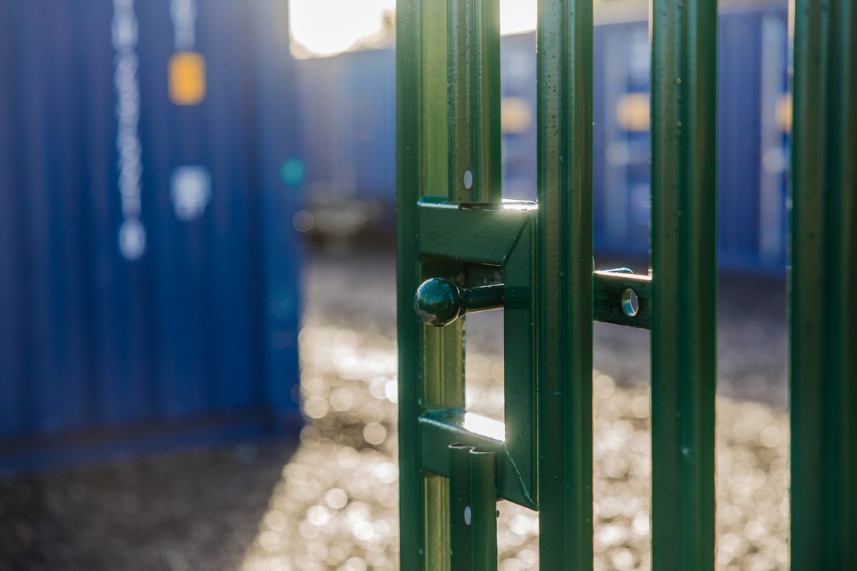 Close up of a metal gate leading into a storage facility.