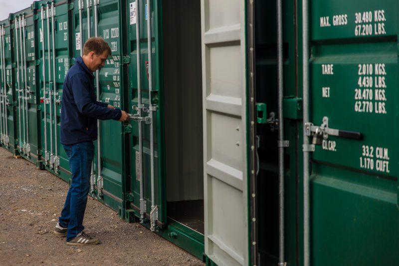 Man opening storage container.
