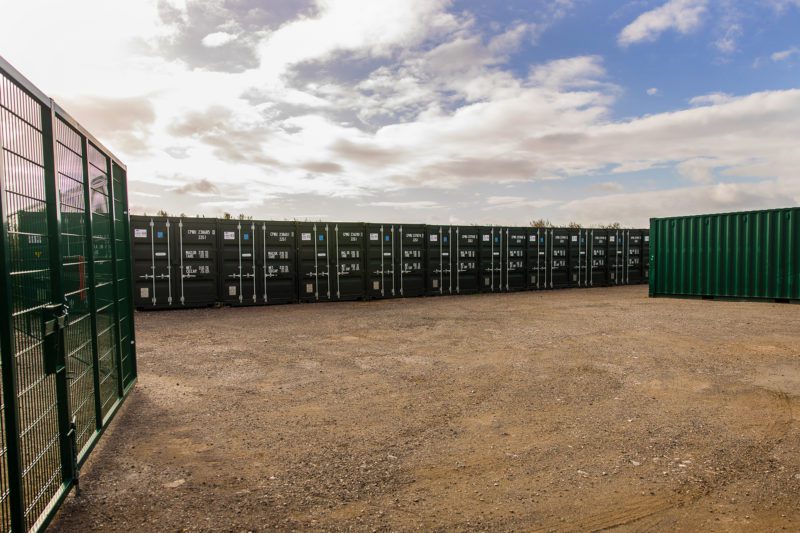 Storage containers at a storage facility on a bright sunny day.